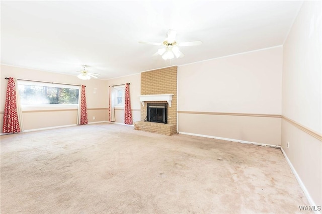 unfurnished living room with ceiling fan, light colored carpet, and a brick fireplace