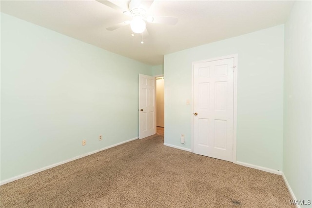 unfurnished bedroom featuring carpet and ceiling fan