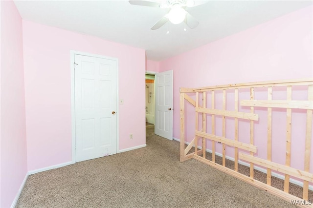 unfurnished bedroom with carpet and ceiling fan