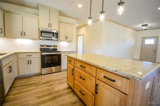 kitchen with tasteful backsplash, ornamental molding, light stone countertops, stainless steel appliances, and light wood-style floors