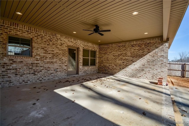 view of patio featuring fence and a ceiling fan