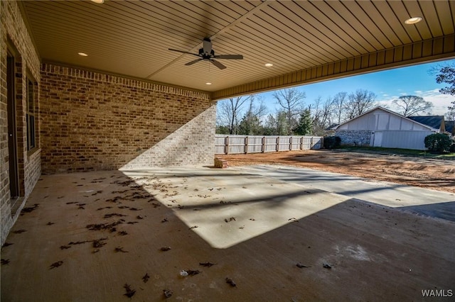 view of patio / terrace with fence and a ceiling fan