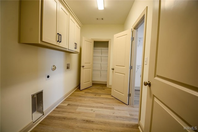 washroom featuring hookup for a washing machine, visible vents, cabinet space, light wood-style floors, and electric dryer hookup