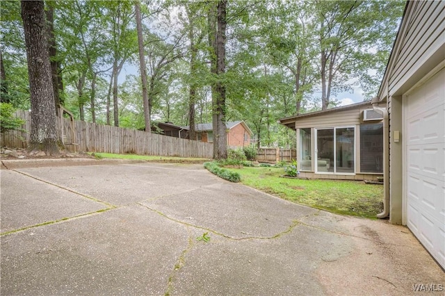 5324 Northwood Lake Dr W, Northport, AL 35473 - view of patio / terrace featuring a sunroom and driveway