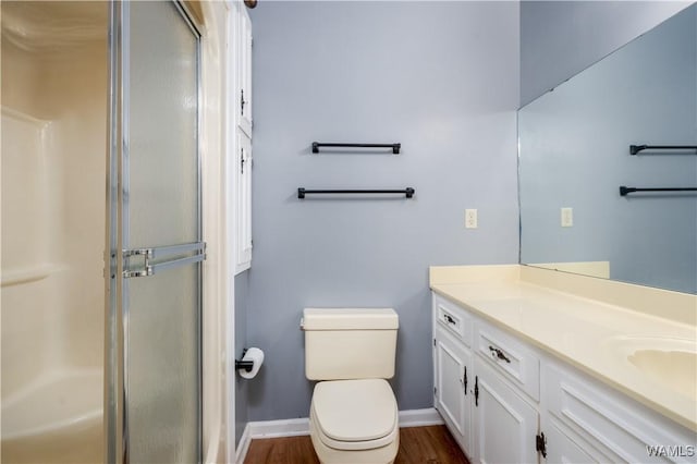 5324 Northwood Lake Dr W, Northport, AL 35473 - full bath with an enclosed shower, vanity, and wood finished floors