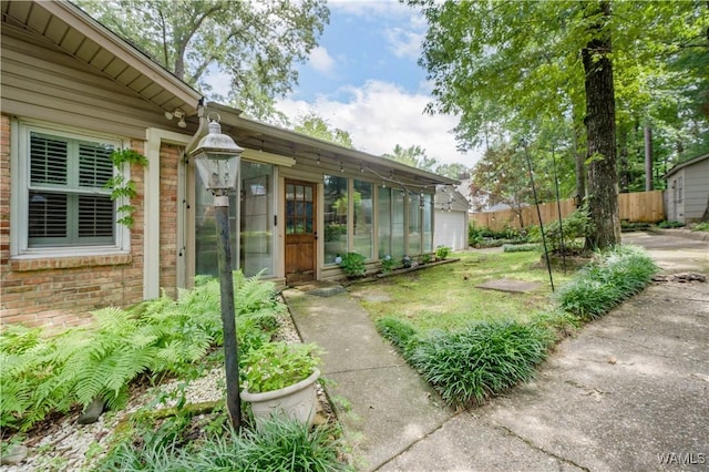 5324 Northwood Lake Dr W, Northport, AL 35473 - view of yard featuring a sunroom