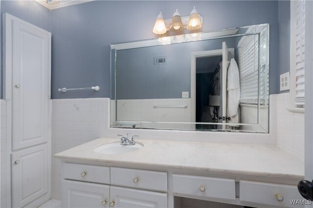 5324 Northwood Lake Dr W, Northport, AL 35473 - bathroom featuring vanity, tile walls, and a wainscoted wall