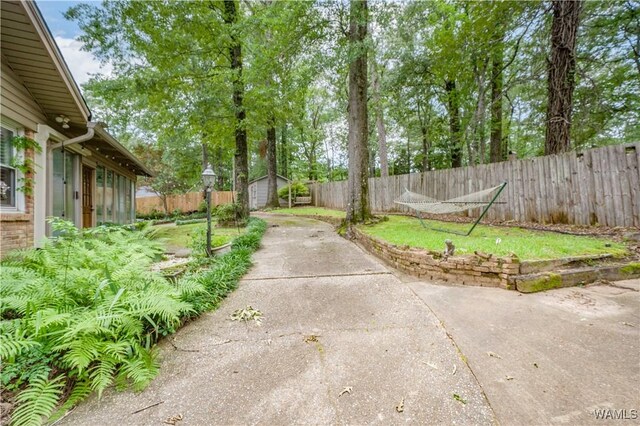 5324 Northwood Lake Dr W, Northport, AL 35473 - fenced backyard featuring a storage shed and a patio