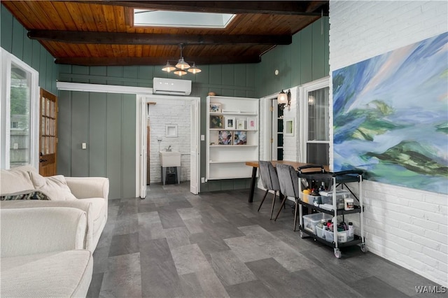 5324 Northwood Lake Dr W, Northport, AL 35473 - living area featuring a wall unit AC, wood ceiling, a skylight, ceiling fan, and wooden walls