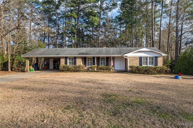 ranch-style house featuring a front yard and a carport