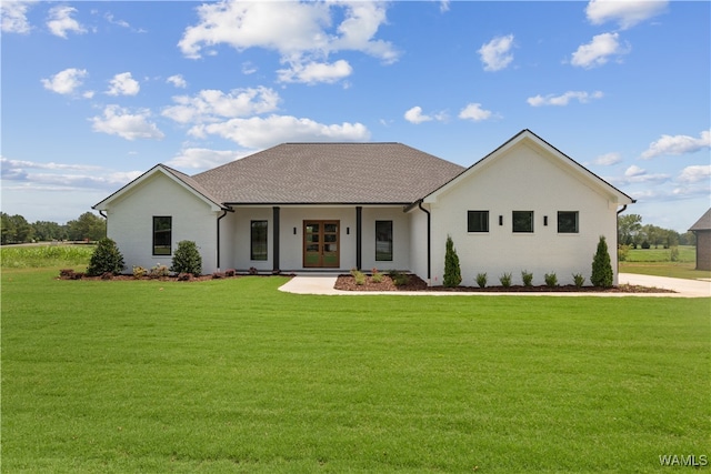 view of front of property with a porch and a front lawn