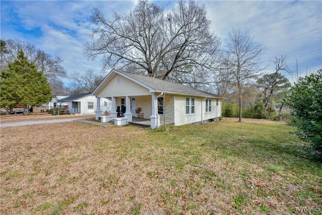 view of front facade with a front yard and a porch