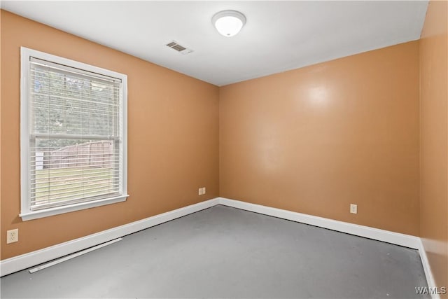 spare room featuring concrete floors