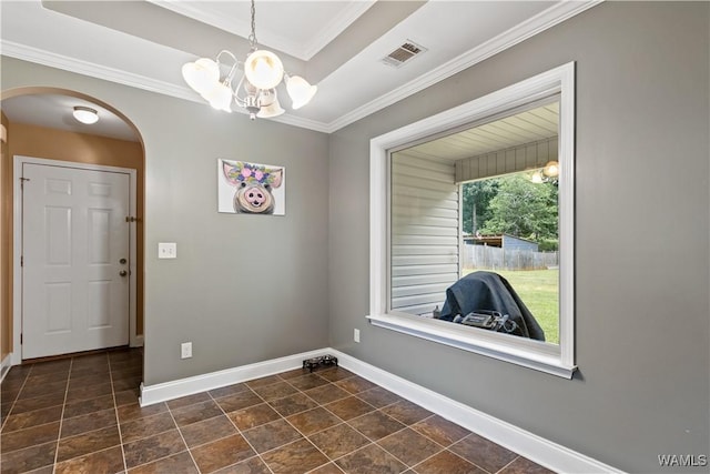 interior space featuring a notable chandelier and ornamental molding