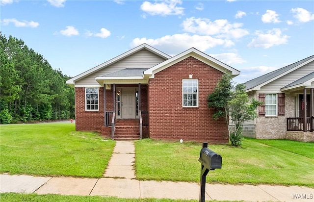 7714 Thompsons Way, Northport, AL 35473 - view of front of home featuring brick siding and a front lawn
