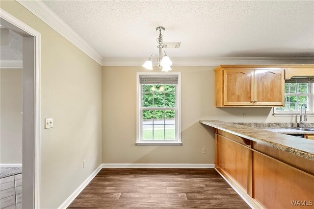7714 Thompsons Way, Northport, AL 35473 - unfurnished dining area with a textured ceiling, crown molding, and dark wood-style floors