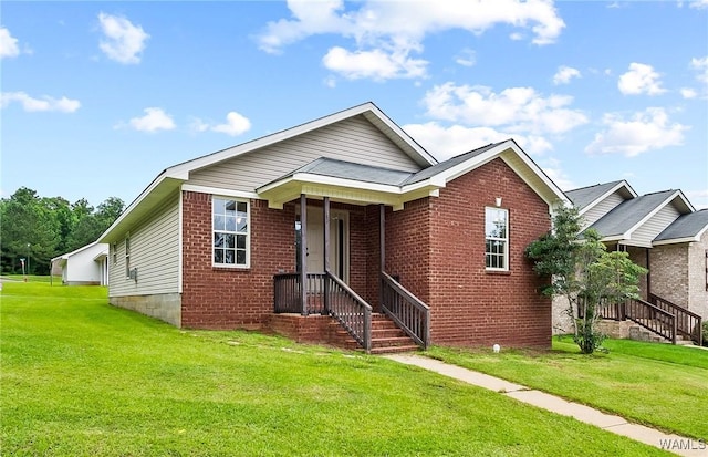 7714 Thompsons Way, Northport, AL 35473 - view of front facade featuring a front lawn and brick siding