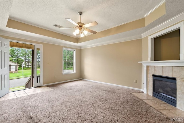 7714 Thompsons Way, Northport, AL 35473 - unfurnished living room with carpet, a tray ceiling, ceiling fan, ornamental molding, and a textured ceiling