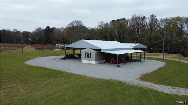 surrounding community featuring a yard and an outdoor structure