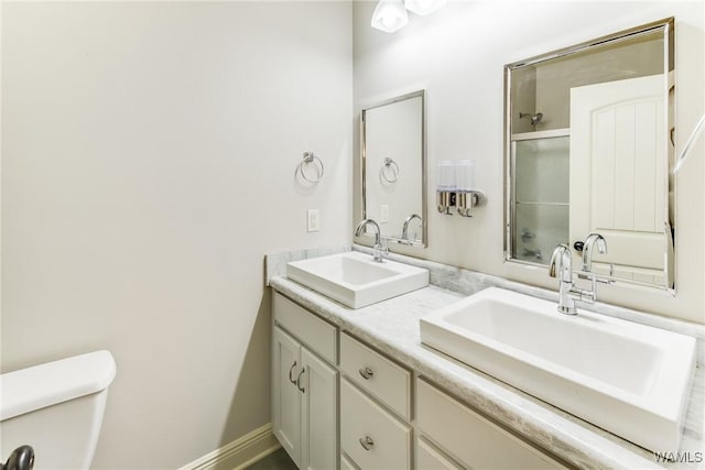 10998 Sleepy Valley Rd, Northport, AL 35475 - bathroom with toilet, double vanity, and a shower with door