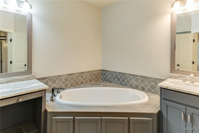 10998 Sleepy Valley Rd, Northport, AL 35475 - bathroom with two vanities and a garden tub