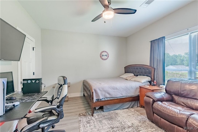 16471 Chase Cir, Ralph, AL 35480 - bedroom with light wood finished floors, a desk, and a ceiling fan