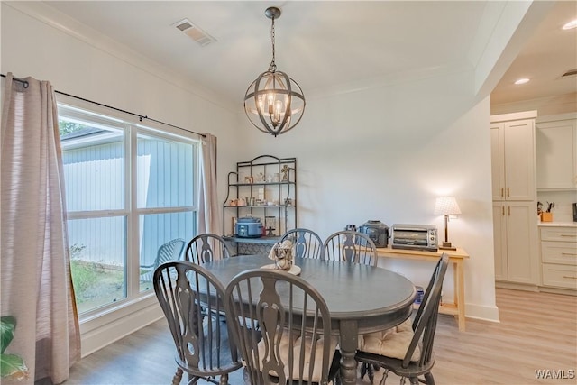 16471 Chase Cir, Ralph, AL 35480 - dining room with light wood-style floors, plenty of natural light, a chandelier, ornamental molding, and recessed lighting