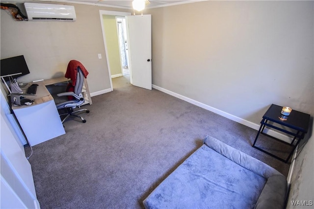 carpeted office with a wall unit AC and baseboards