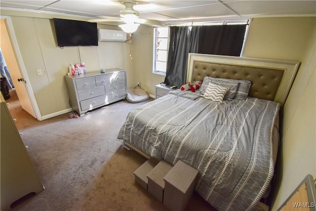 bedroom featuring a ceiling fan, carpet, and a wall unit AC