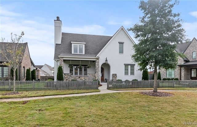 view of front of home with a front lawn