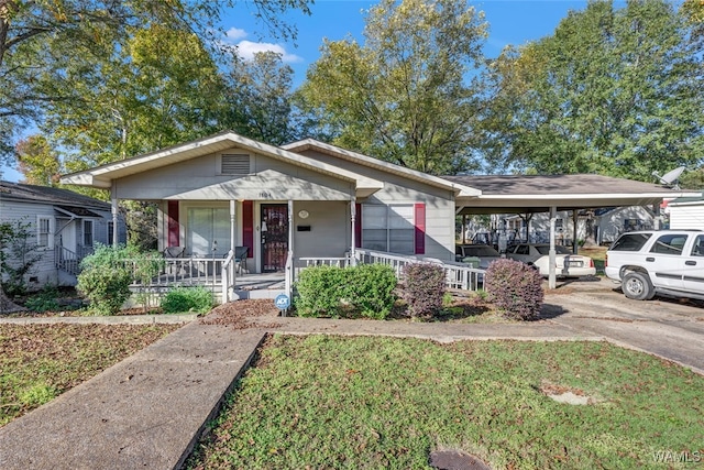 view of front of property with a carport and a porch