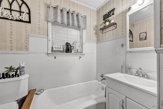 bathroom with a bath, crown molding, toilet, vanity, and tile walls