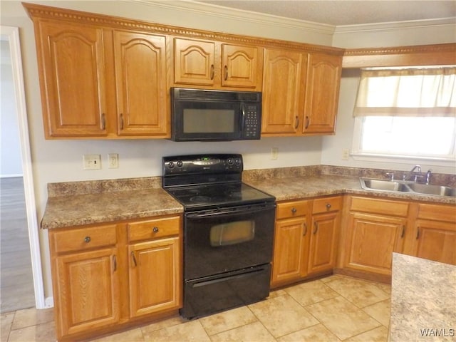 kitchen with crown molding, brown cabinets, a sink, and black appliances