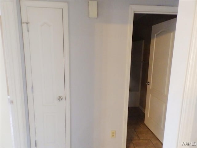 hallway featuring tile patterned floors