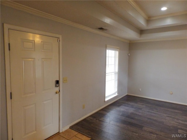 entryway featuring ornamental molding, dark wood-style flooring, visible vents, and baseboards