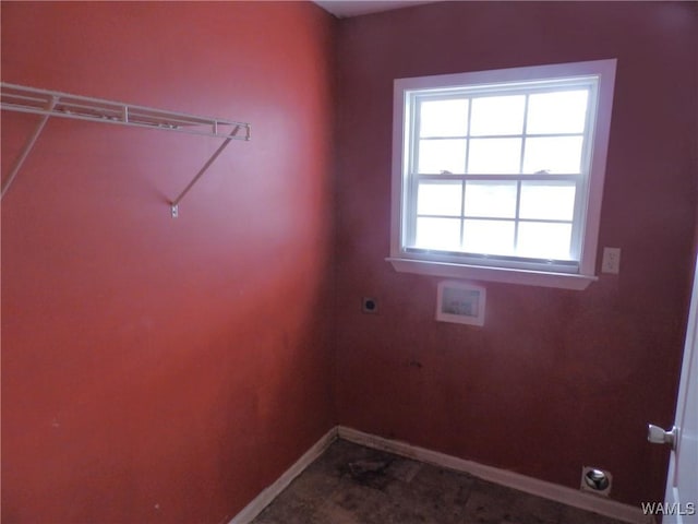 laundry area featuring laundry area, baseboards, washer hookup, and hookup for an electric dryer