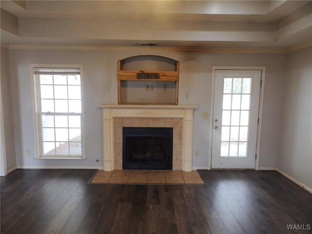 unfurnished room featuring concrete floors, ornamental molding, and a healthy amount of sunlight