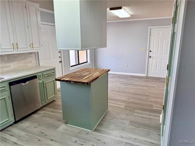 kitchen with wooden counters, stainless steel dishwasher, a textured ceiling, a kitchen island, and green cabinets