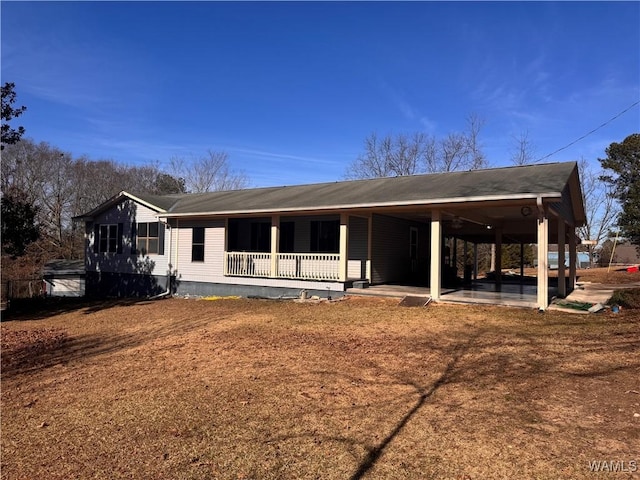 view of front of property with covered porch and a patio