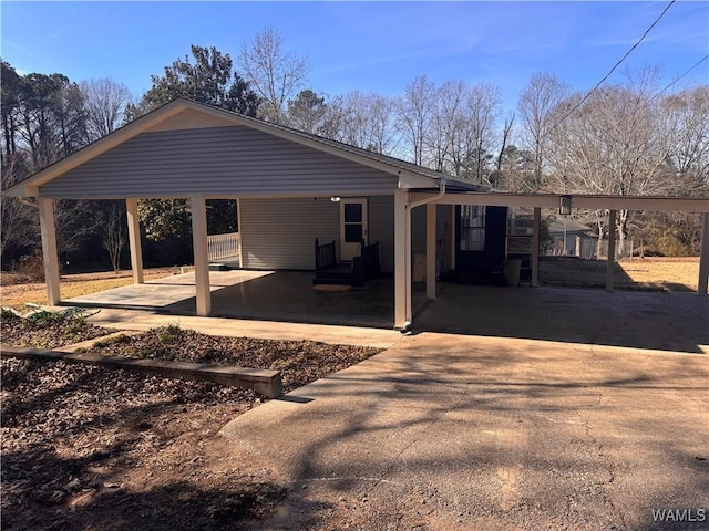 rear view of house featuring a carport