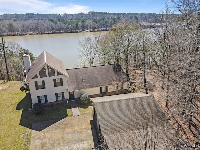 aerial view with a view of trees and a water view