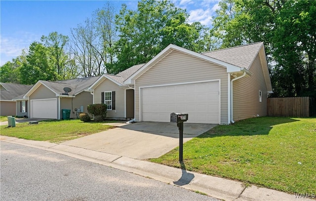 single story home with a front yard, driveway, fence, and a garage