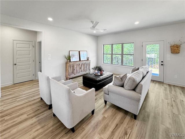 living room with baseboards, recessed lighting, light wood-type flooring, and a ceiling fan