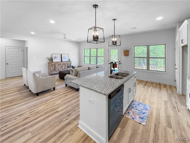 kitchen with dishwasher, a sink, visible vents, and a wealth of natural light