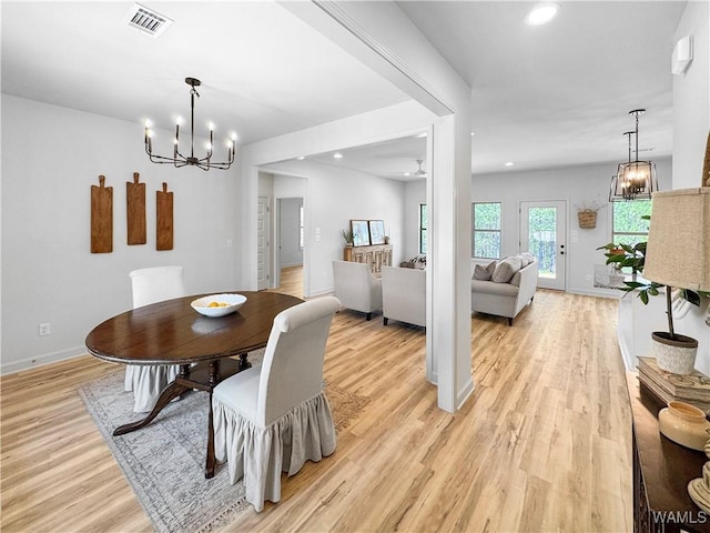 dining room with visible vents, baseboards, an inviting chandelier, light wood-style floors, and recessed lighting