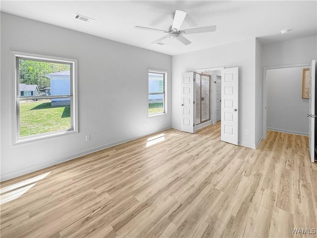 unfurnished bedroom with ensuite bathroom, a ceiling fan, visible vents, light wood finished floors, and baseboards