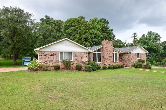 ranch-style home with a front lawn