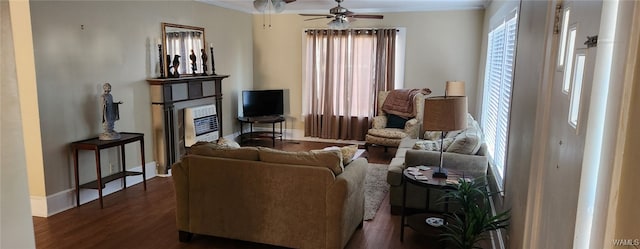 living room featuring dark hardwood / wood-style flooring and ceiling fan