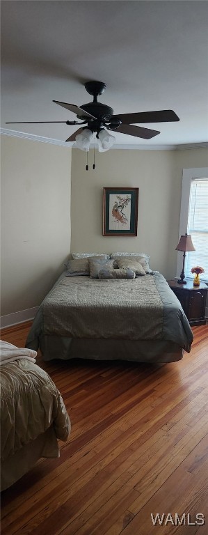 bedroom with wood-type flooring and ceiling fan