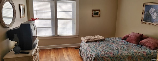 bedroom with light hardwood / wood-style floors